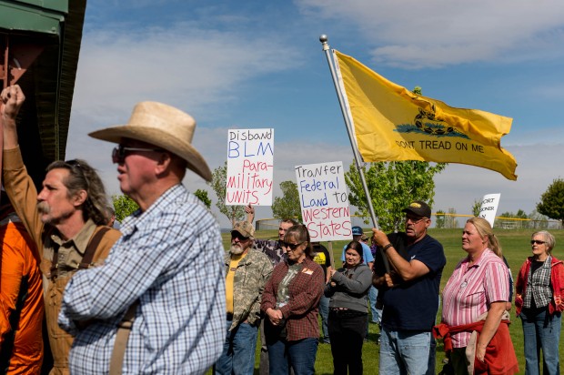 People listen to San Juan County Commissioner Phil Lyman at Centennial Park in Blanding, Utah on Saturday, May 10, 2014. Lyman organized an ATV protest ride into nearby Recapture Canyon to show that the federal agency isn't the "supreme authority" and local residents have a right to have their opinions heard. The area has been closed to motorized use since 2007 when an illegal trail was found that cuts through Ancestral Puebloan archaeological sites. The canyon is open to hikers and horseback riders. (AP Photo/The Salt Lake Tribune, Trent Nelson)