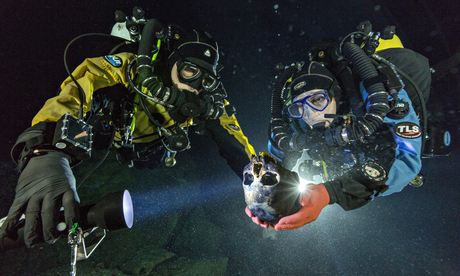 Divers with the 12,000-year-old skull of a girl