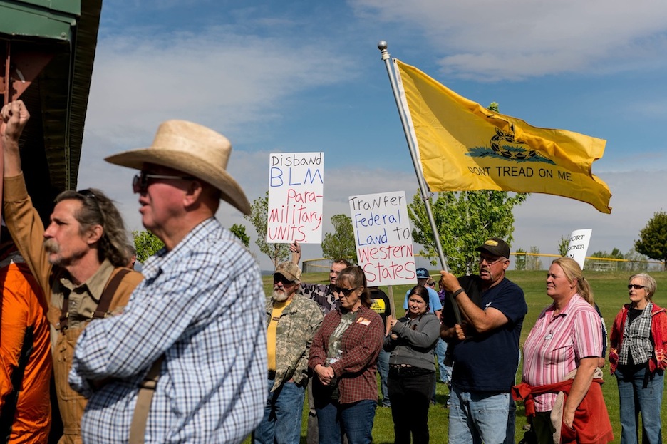 People listen to San Juan County Commissioner Phil Lyman at Centennial Park in Blanding, Utah on Saturday, May 10, 2014. Lyman organized an ATV protest ride into nearby Recapture Canyon to show that the federal agency isnt the supreme authority and local residents have a right to have their opinions heard. The area has been closed to motorized use since 2007 when an illegal trail was found that cuts through Ancestral Puebloan archaeological sites. The canyon is open to hikers and horseback riders. (AP Photo/The Salt Lake Tribune, Trent Nelson)