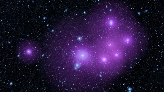Image of the Fornax cluster of galaxies with artistically enhanced purple areas representi...