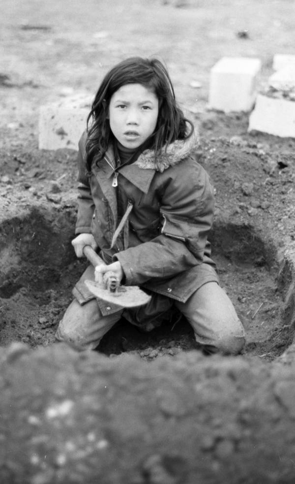 A child digs a foxhole during the 1973 occupation at Wounded Knee. (Kevin McKiernan)