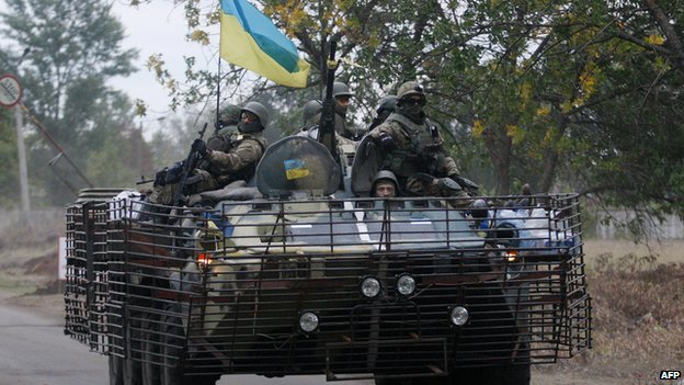 Ukrainian soldiers patrol in a APC in the eastern Ukrainian city of Kramatorsk, Donetsk region on 11 September 2014. 