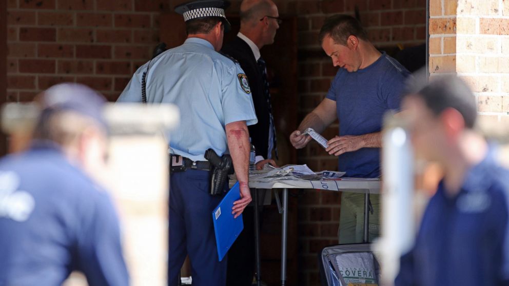 PHOTO: Police investigators work in a garage at a home at Guildford in suburban Sydney, Australia after federal and state police officers raided more than two dozen properties as part of the operation, Sept. 18, 2014. 