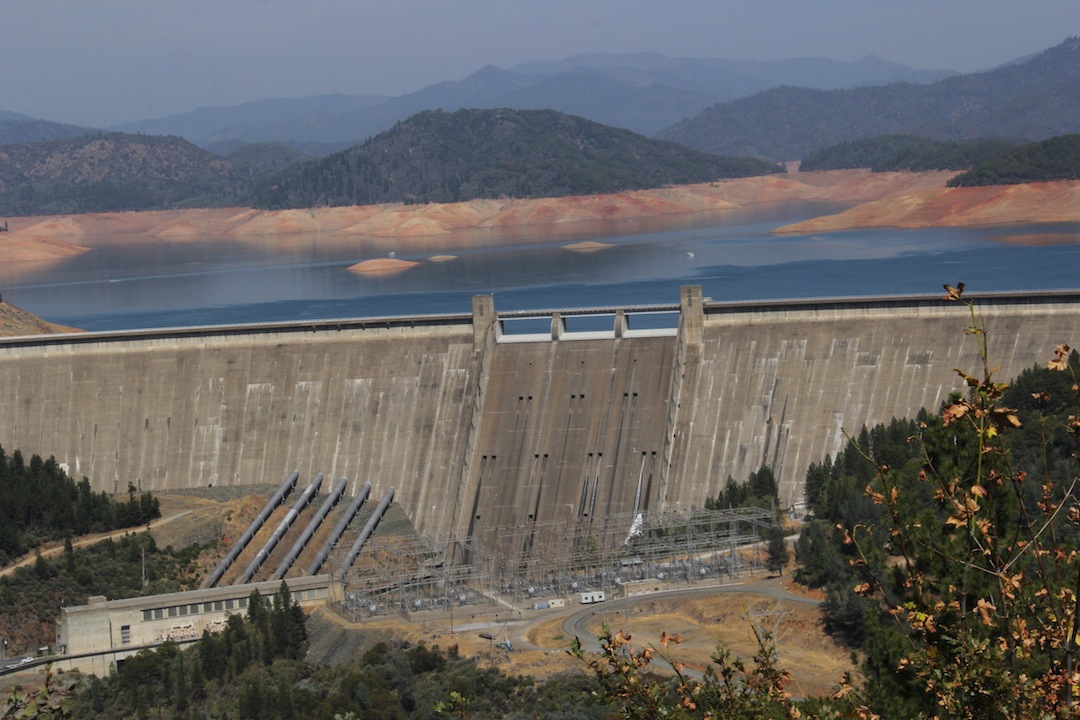 Constructed between 1938 and 1945, the 602-foot Shasta Dam flooded more than 20 miles of the McCloud River, the Winnemem Wintus ancestral homelands, as part of the Central Valley Project, which transformed California into an international agricultural power. (Marc Dadigan)