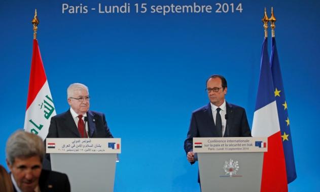 French President Francois Hollande (R), Iraq's President Fuad Masum and U.S. Secretary of State John Kerry  (front, L) arrive to attend the opening of an international conference bringing together about 30 countries to discuss how to cooperate in the fight against Islamic State militants in Paris September 15, 2014.  REUTERS-Christian Hartmann