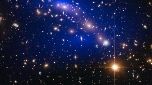 Galaxy cluster MACS J0416.12403 with dark matter map (Image: NASA/ESA)