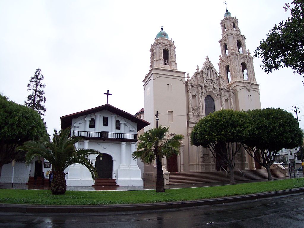 18th-century Spanish Colonial Mission San Francisco de Asis�Mission Dolores (left), and early 20th-century Spanish Colonial Revival style parish church (right). Mission District, San Francisco. (Wikipedia)