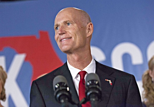 Image: Fla.'s Scott Sues to Stop Cuts to Healthcare Under Obamacare