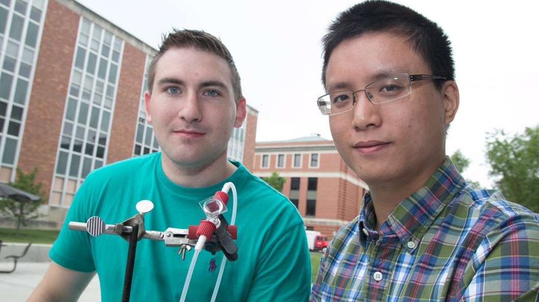 The Ohio State University researchers with the prototype device they call the first aqueous solar flow battery