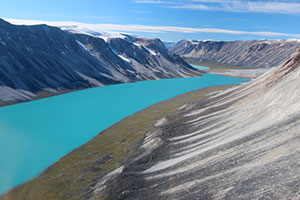 n western Greenland, small outlet glaciers are wasting backward, leaving behind piles of rocks, or moraines, that mark their previous advances. Meltwater has formed a lake. Image credit: Jason Briner