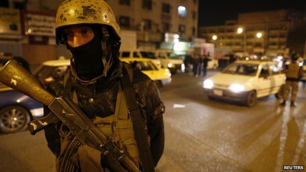 A member of Iraq's security forces stands guard at Tahrir Square in Baghdad February 8, 2015