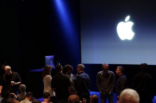 Attendees wait for the start of an event at Apple headquarters on Thursday, Oct. 16, 2014 in Cupertino, Calif. (AP Photo/Marcio Jose Sanchez)