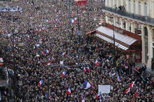 The crowd gathers during a march in Paris, France, Sunday, Jan. 11, 2015. Hundreds of thousands of people marched through Paris on Sunday in a massive show of unity and defiance in the face of terrorism that killed 17 people in France's bleakest moment in half a century. (AP Photo/Laurent Cipriani)