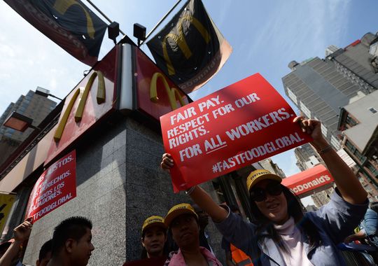 Fast-food workers from around the world stage a protest