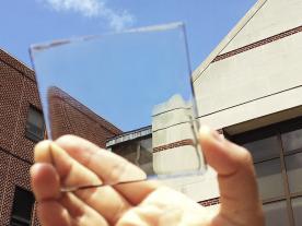 The new material from Lunts lab, which can absorb sunlight without losing its transparency. (Photo: Yimu Zhao)