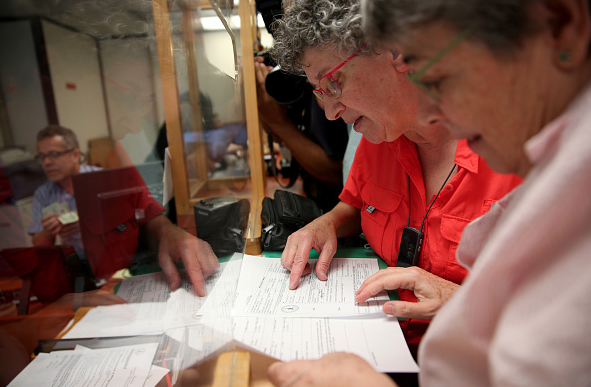 MIAMI, FL - JANUARY 05: Deborah Shure (L) and Aymarah Robles apply for their marriage license at the Clerk of the Courts - Miami-Dade County Court on January 5, 2015 in Miami, Florida. Gay marriage is now legal statewide after the courts ruled that the ban on gay marriage is unconstitutional and the Supreme Court declined to intervene. (Photo by Joe Raedle/Getty Images)