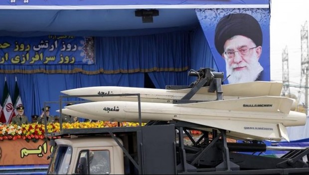 A military truck carrying Shalamcheh missiles drives past the presidential rostrum during the annual Army Day military parade on April 18, 2014 in Tehran. On the right is a portrait of Iran's supreme leader Ayatollah Ali Khamenei. (Photo: Atta Kenare/Getty Images)