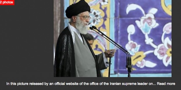 This photo accompanied AP�s coverage of the speech, but the gun was not mentioned in the copy. (Screenshot: APBigStory)