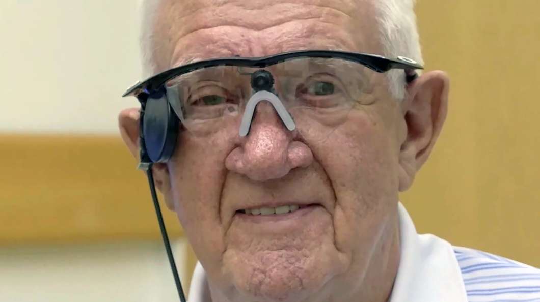 The 80-year-old Raymond Flynn was the first to receive the implant for AMD treatment