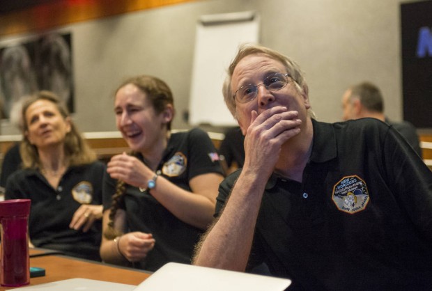 Scientists react to seeing photos from the flyby. (Image source: NASA-JHUAPL-SwRI)