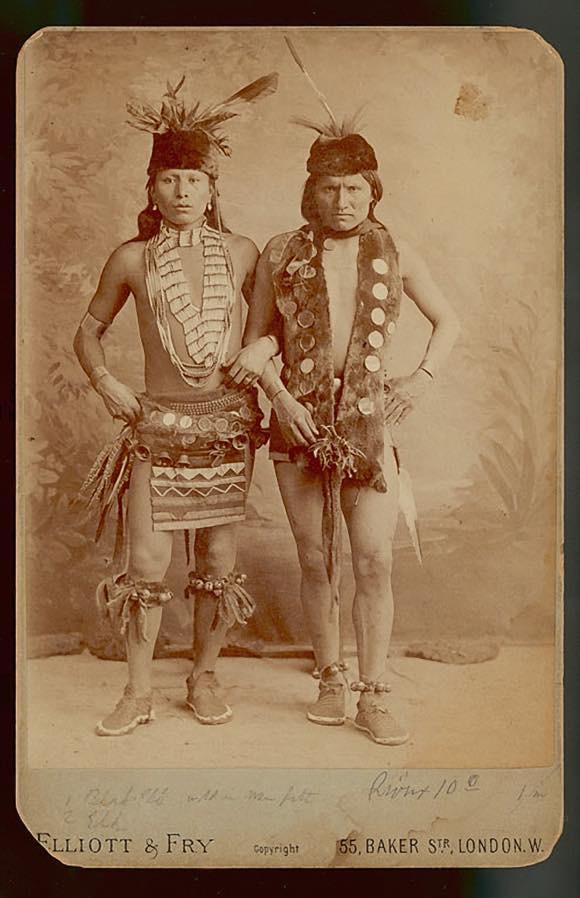 Black Elk and Elk of the Oglala Lakota as grass dancers touring with the Buffalo Bill Wild West Show, London, England, 1887. The men are wearing sheep and sleigh bells; otter fur waist and neck pieces; pheasant feather bustles at the waist; dentalium shell necklaces; and bone hairpipes with colored glass beads. Photograph collected on Pine Ridge Reservation in 1891 by James Mooney. Courtesy National Anthropological Archives, Smithsonian Institution
