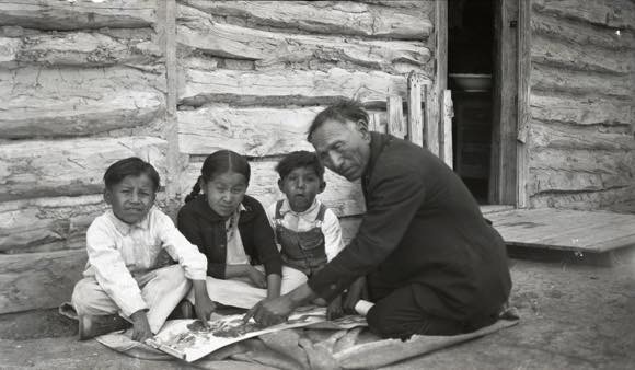 Black Elk, Age ca. 62-63, 1927 or 1928. He taught the faith with the Two Roads picture map with the Good Red Road (red = Jesus blood) and the Black Road of Difficulties, at Broken Nose cabin, Pine Ridge Reservation. Marquette University E-Archives