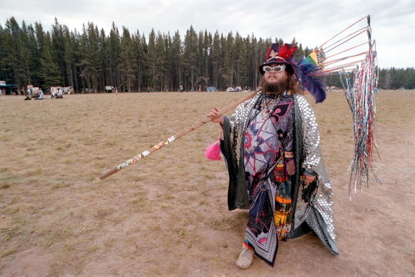 William, who said he is a wizard, saunters across a meadow on July 4, 2001 during the Rainbow Family Gathering in Cache Creek Meadow, Idaho. Getty Images.
