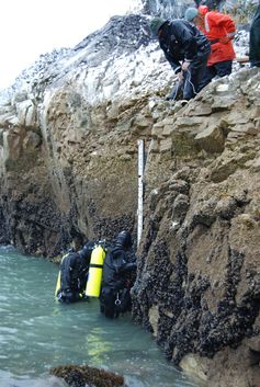 Installing a tide gauge in Alaska. Photo credit: NOAA Photo Library