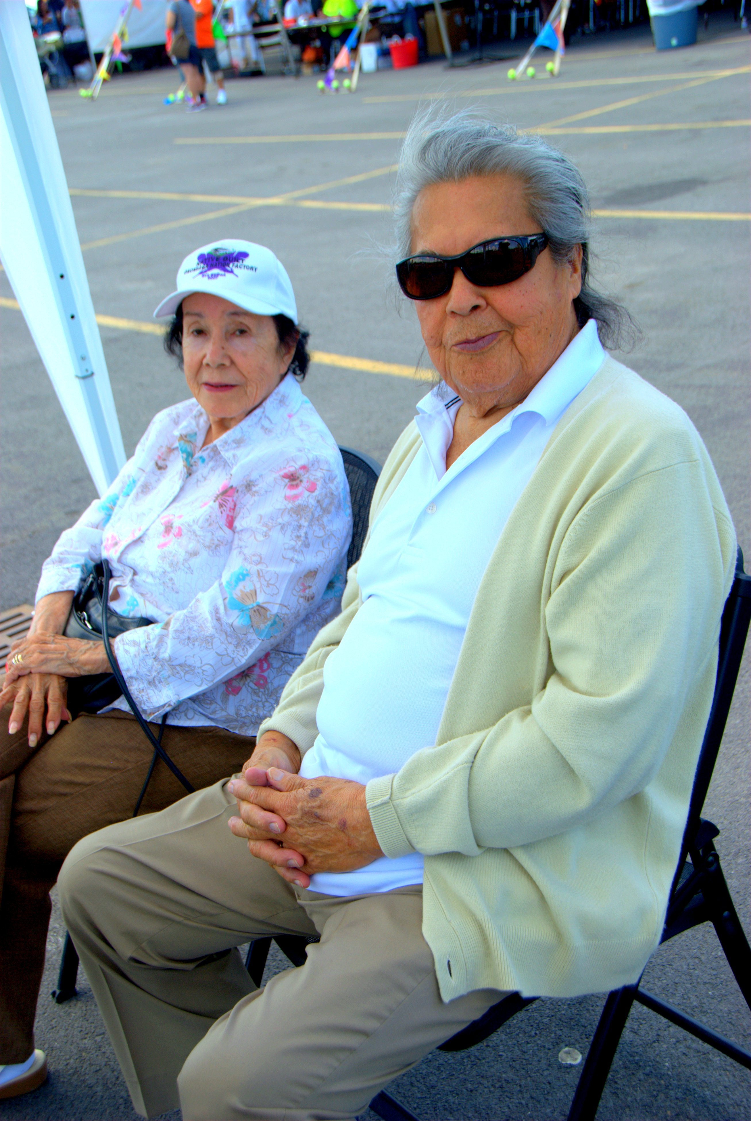 Two elder spectators at the Saint Regis Mohawk Tribes Annual Ironworkers competition in Akwesasne, New York sit back and enjoy the fun. (Vincent Schilling)