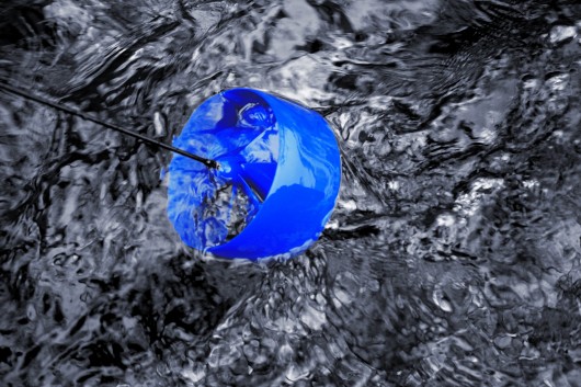 The micro turbine flows in the current while the base station stays on land 