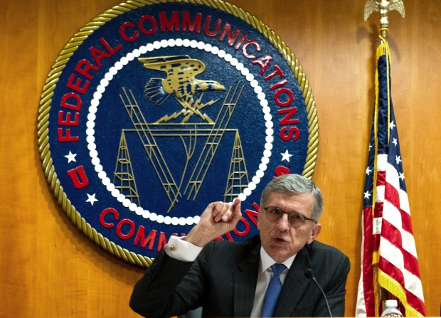 Federal Communications Commission (FCC) Chairman Tom Wheeler speaks before calling for a vote during a meeting of the commissioners on May 15, 2014 at the FCC in Washington, DC. (AFP Photo / Karen Bleier) 