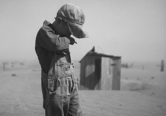 A young boy covers his mouth during a dust storm on farm. Cimarron County, Oklahoma. April 1936. Image credit: Arthur Rothstein; The Library of Congress, Prints & Photographs Division