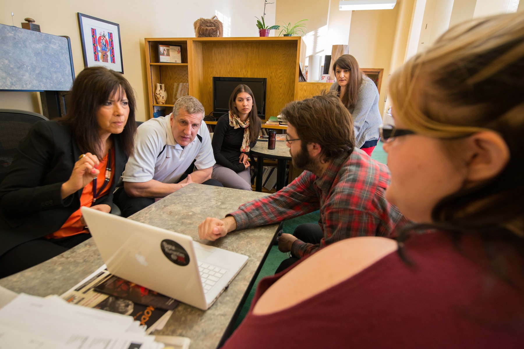 Students at the University of Nebraska-Lincoln work with the Nebraska Commission on Indian Affairs on a deep map of the Standing Bear Historic Trail. Pictured, from left, are: Judi gaiashkibos, executive director for NCIA; Scott Shafer, administrative assistant for NCIA; Naomi Szpot, administrative secretary for NCIA; Joseba Moreno, graduate student, University of Nebraska-Lincoln; Alicia Harris, administrative secretary for NCIA; and Erin Carr, University of Nebraska-Lincoln student. (University of Nebraska-Lincoln)