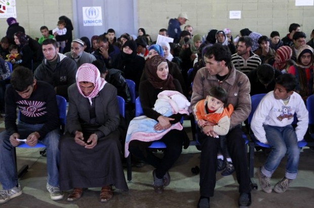 Syrian families wait their turn to register at the UNHCR center in the northern city of Tripoli, Lebanon, Wednesday, March. 6, 2013 (AP Photo/Bilal Hussein)