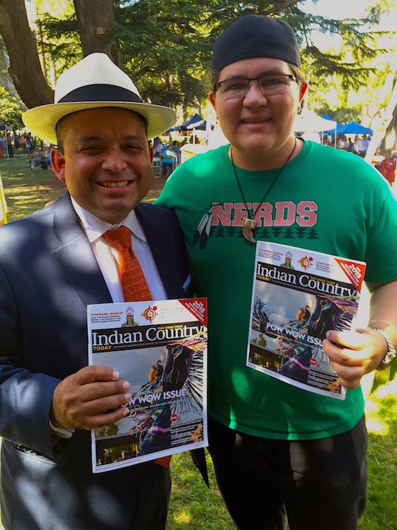 Left to right, Assembly Member Luis Alejo and Dahkota Brown. In response to a request by Miwuk youth leader Dahkota Brown, Assembly Member Luis Alejo sponsored AB 30, a bill to ban the use of racist mascots in California, including the term redskins. At last year's Native American Day, Brown asked Alejo to sign a petition banning racist mascots that negatively portray Native people. Though prior attempts had failed, AB 30 passed the California Assembly and the Senate this year, and now awaits Gov. Brown's signature. Dahkota Brown said Alejo taught him how to work with government and media to make positive social change. (Photo: Valerie Taliman)
