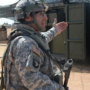 Staff Seargent James Clarke, from the 563rd Quartermaster Company, shows his Force Provider System air-conditioned living ...