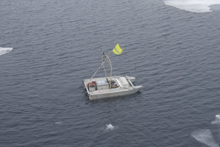 Launching the remote controlled sampling boat in Arctic waters (Josh Griffiths, University of Bangor)