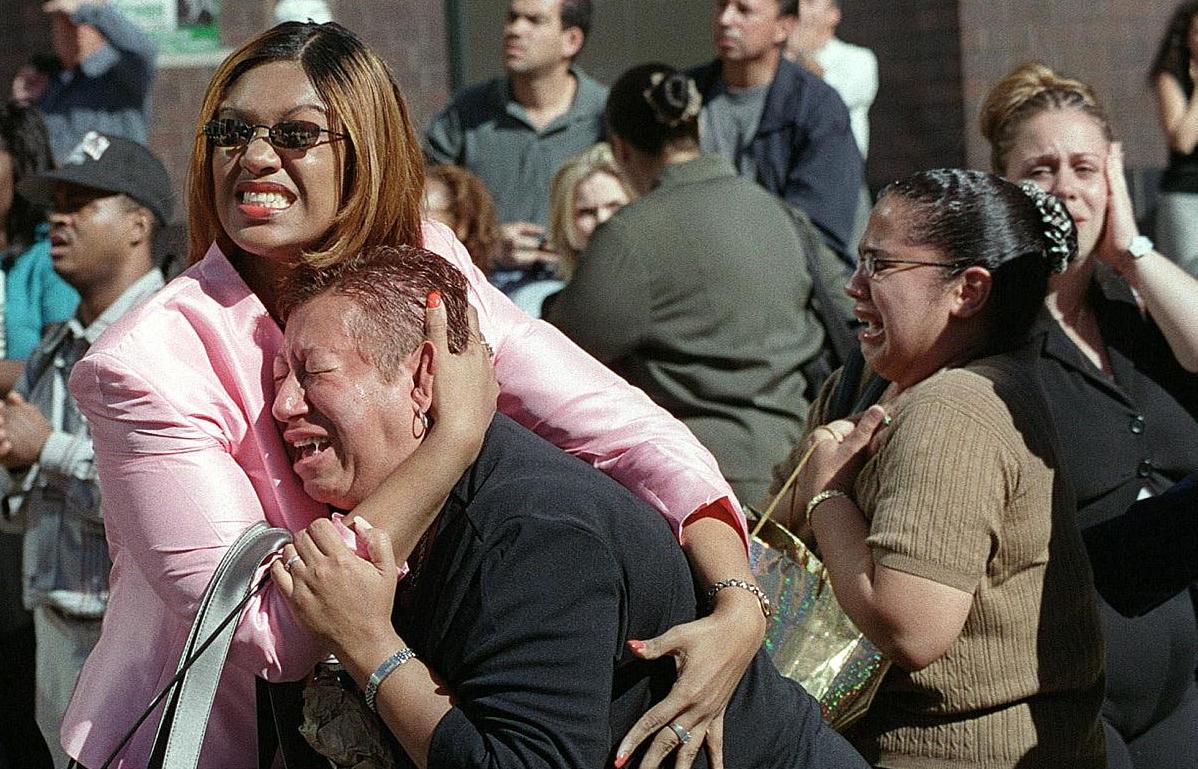 Two women hold each other in shock and grief on Sep. 11, 2001 after planes crashed into the Twin Towers in New York City