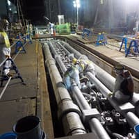 Fukushima workers pour brine into the refrigerated pipes
