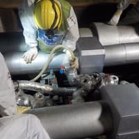 Fukushima workers pour brine into the refrigerated pipes