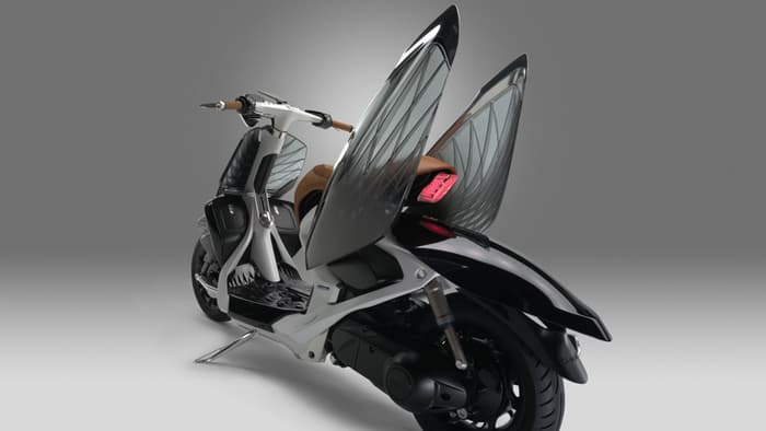 Lifting the side panels of the Yamaha 04Gen provides access to the scooter's inner workings and ...