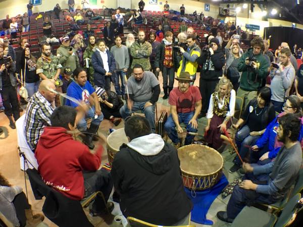 Drummers kick off a daylong powwow for Veterans Stand for Standing Rock at the Prairie Knights Casino and Resort Pavilion, where as many as 400 people, mostly veterans, were stranded in a North Dakota blizzard. (Photo: Jenni Monet)