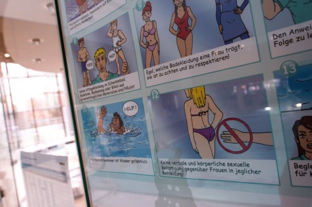 A poster informs about pool rules in a public swimming pool in Munich, southern Germany, on January 12, 2016. The city of Bornheim near Bonn, western Germany, has decided to ban male asylum seekers from its public pool since women have complained about harassment by migrants. (Photo: Sven Hoppe/AFP/Getty Images)