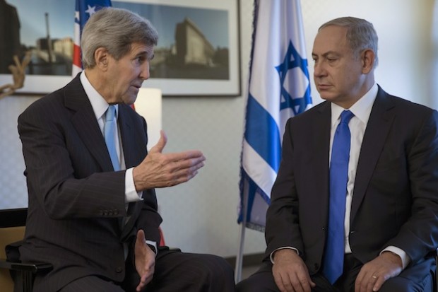 U.S. Secretary of State John Kerry, left, speaks with Israeli Prime Minister Benjamin Netanyahu during a meeting in Berlin, Germany Thursday, Oct. 22, 2015. (Carlo Allegri/Pool Photo via AP)