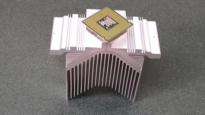 A CPU bonded to a heat sink, using the new glue