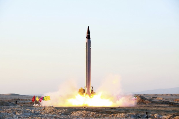 This picture released by the official website of the Iranian Defense Ministry on Sunday, Oct. 11, 2015, claims to show the launching of an Emad long-range ballistic surface-to-surface missile in an undisclosed location. Iran successfully test fired a new guided long-range ballistic surface-to-surface missile, state TV reported on Sunday. It was the first such a test since Iran and world powers reach a historical nuclear deal. Iran's Defense Minister Gen. Hossein Dehghan, told the channel that the liquid-fuel missile "will obviously boost the strategic deterrence capability of our armed forces." (Iranian Defense Ministry via AP)
