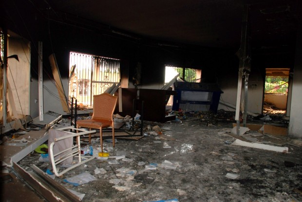 In this Sept. 12, 2012, file photo, glass, debris and overturned furniture are strewn inside a room in the gutted U.S. consulate in Benghazi, Libya, after an attack that killed four Americans, including Ambassador Chris Stevens. (AP Photo/Ibrahim Alaguri, File)