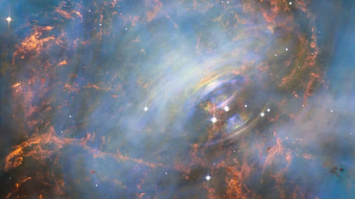 View of the Crab Nebula made up of three separate Hubble images
