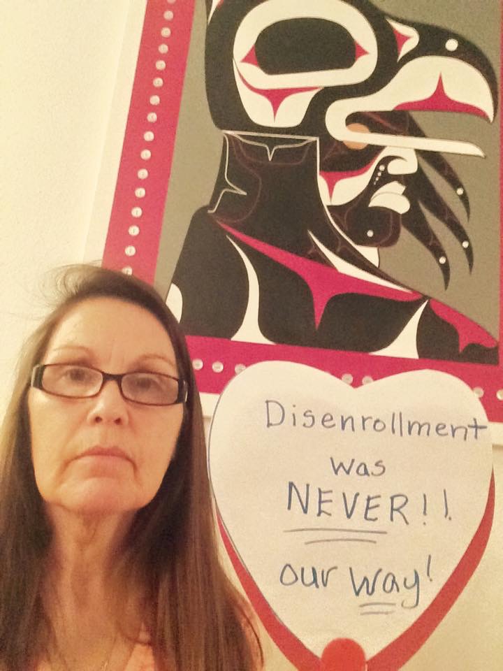 Former GED instructor for the Nooksack tribe Deborah Alexander stands in front of a poster supporting the Nooksack 306. (Courtesy Deborah Alexander)