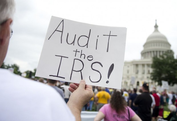 Demonstrators with the Tea Party protest the Internal Revenue Service (IRS) targeting of the Tea Party and similar groups during a rally called 'Audit the IRS' outside the US Capitol in Washington, DC, June 19, 2013. (SAUL LOEB/AFP/Getty Images)